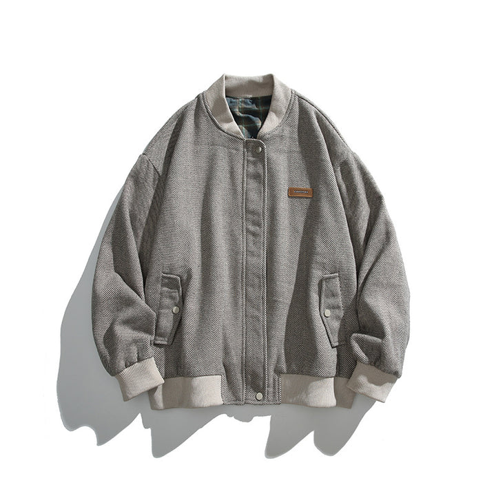 Unisex boxy bomber jacket in herringbone look with ribbed cuffs, flap pockets, and concealed snap button placket Mune Fashion