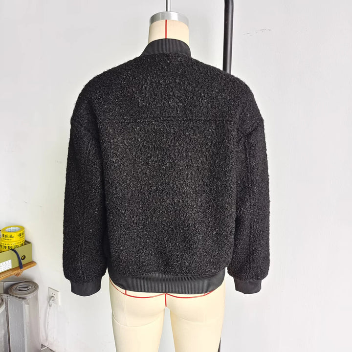 Ladies cozy teddy bomber jacket in college style with concealed snap button placket and integrated pockets Mune Fashion