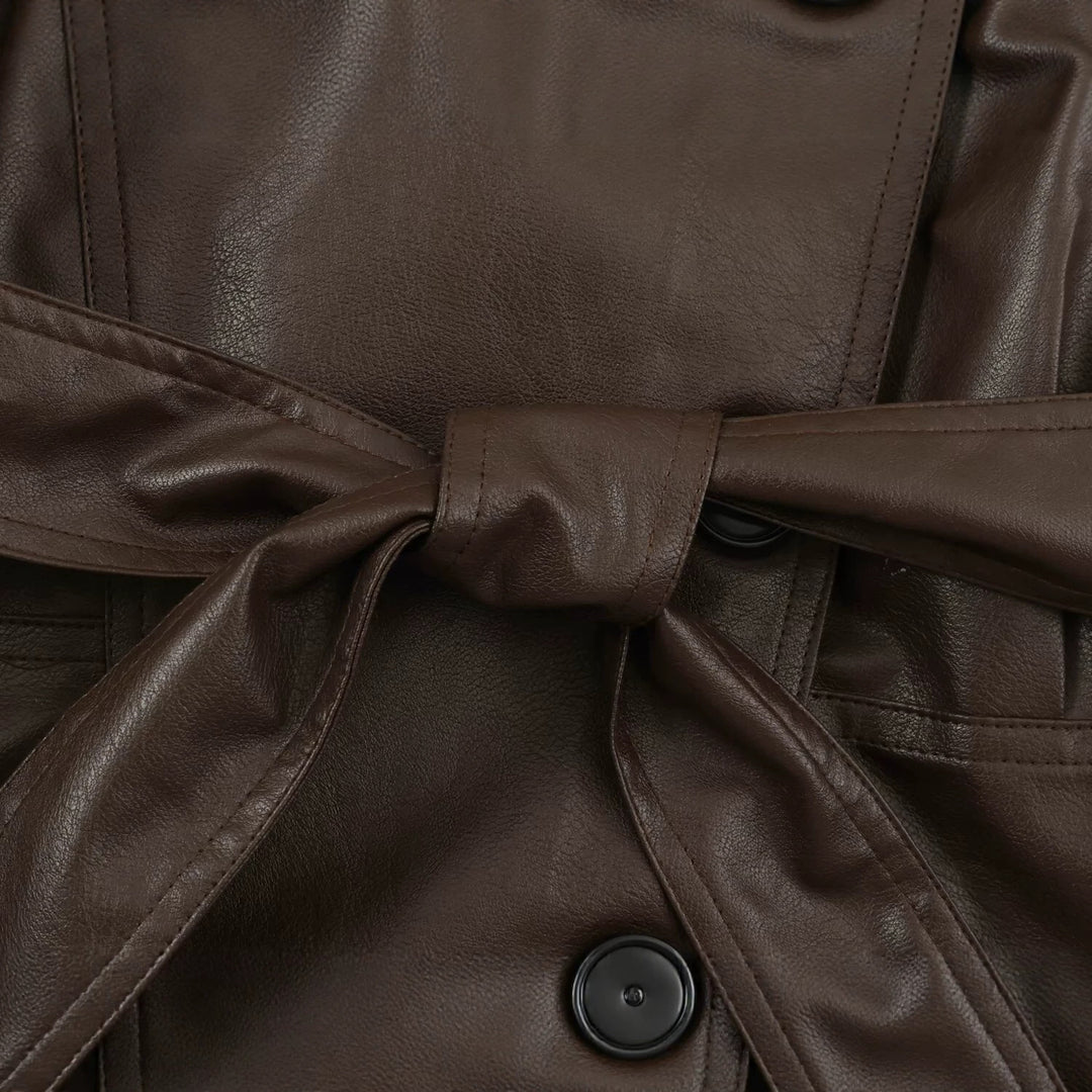 Women's tailored cropped faux leather jacket with tie belt and asymmetric button placket Mune Fashion