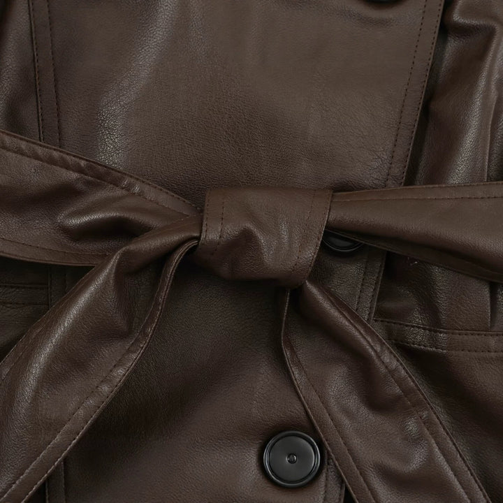 Women's tailored cropped faux leather jacket with tie belt and asymmetric button placket Mune Fashion