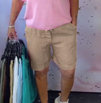 Women's linen bermuda shorts with turn-up hem, button and zip fastening, as well as side pockets Mune Fashion