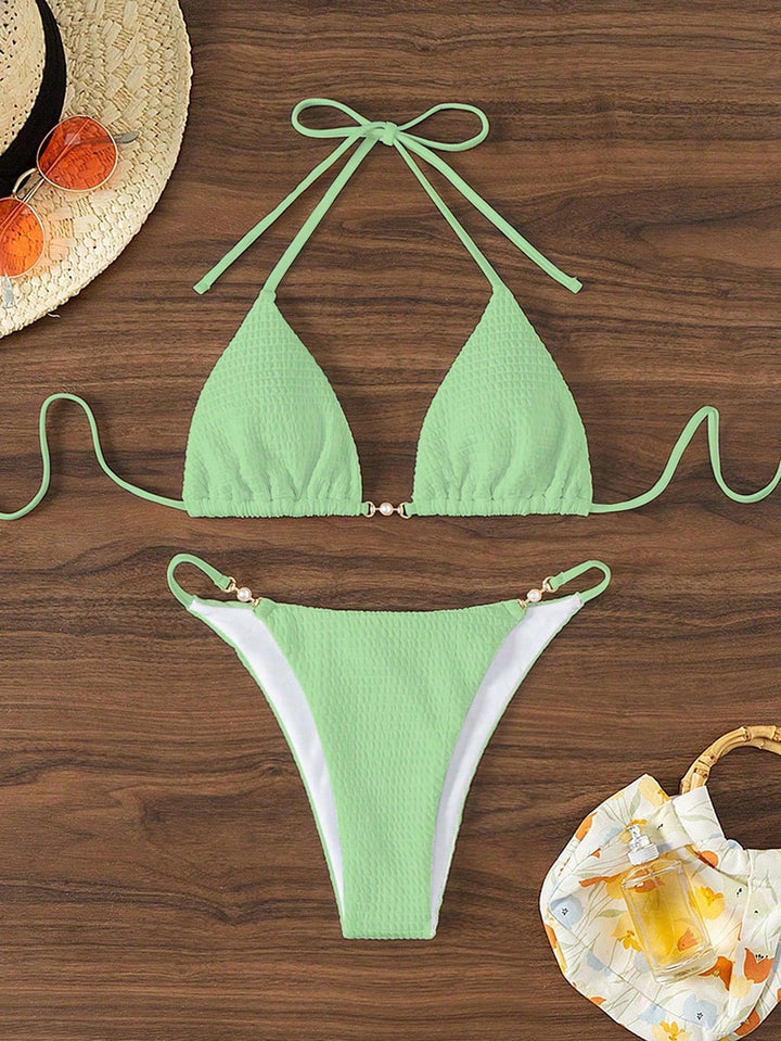 Women's Triangle Bikini with fashionable lacing details and elegant accents Mune Fashion