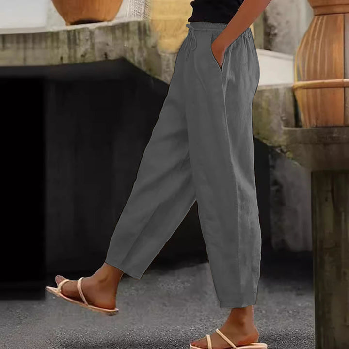 Women's loose-fitting linen blend pants with elastic waistband, drawstring, and angled side pockets Mune Fashion