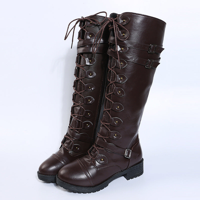 Women knee-high lace-up boots with side zipper, adjustable decorative straps and patterned rubber sole Mune Fashion