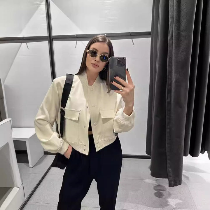 Women's short bomber jacket with snap button front, applied flap pockets and ribbed hem Mune Fashion