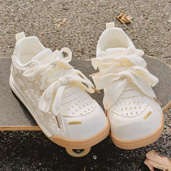 Ladies sporty platform sneakers with perforated upper material and decorative bows Mune Fashion