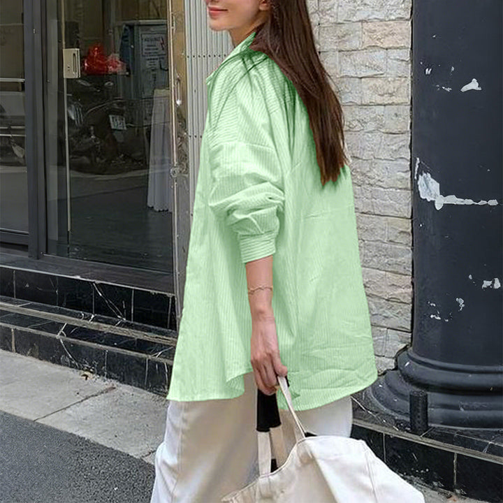 Women's oversized shirt with fine pinstripe structure, Kent collar, rounded hem, and buttoned cuffs Mune Fashion
