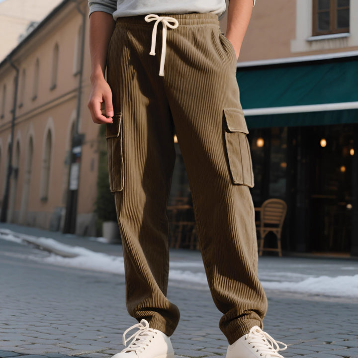 Men's casual utility cargo joggers with vertical ribbed structure, drawstring waistband, and large flap pockets Mune Fashion