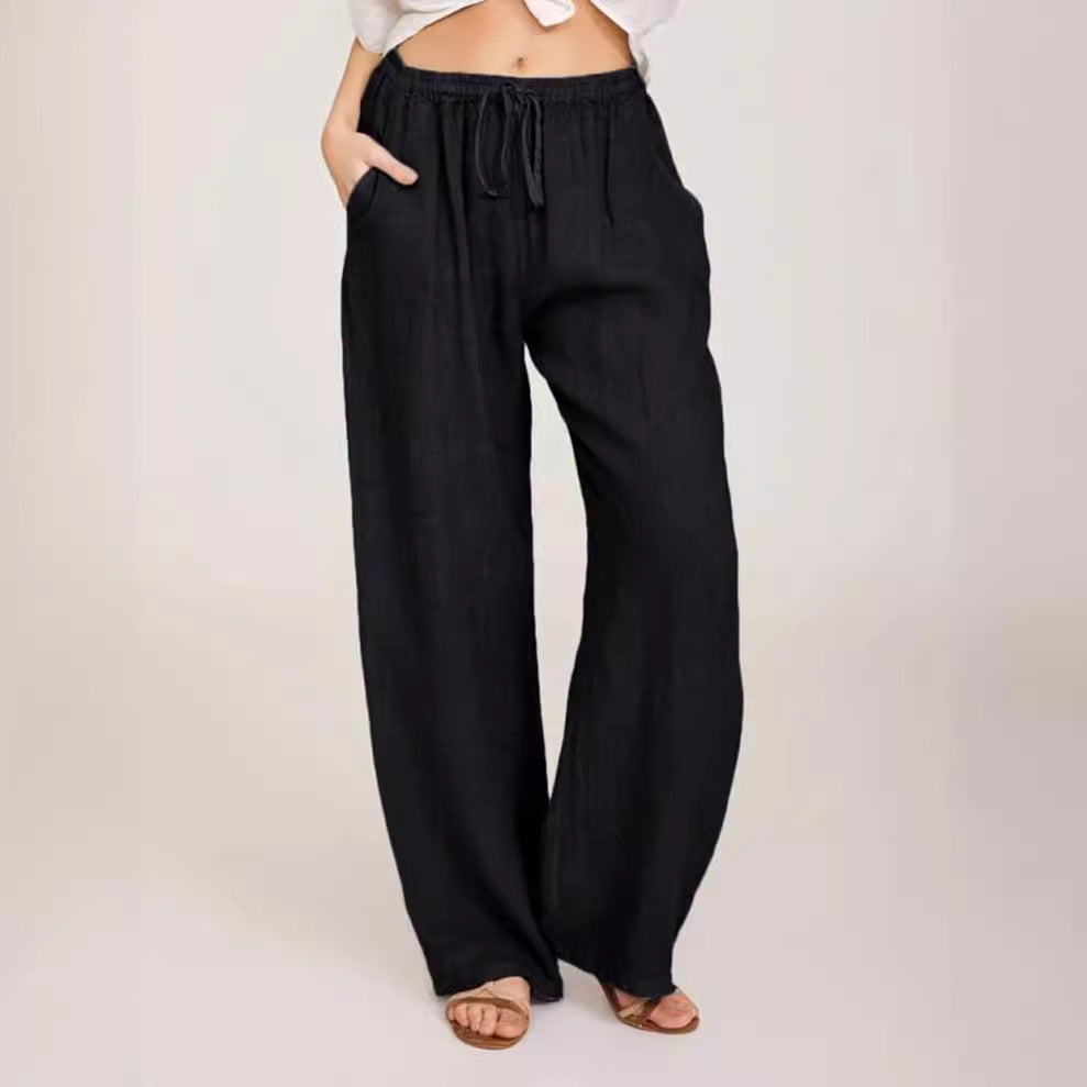 Women's airy palazzo pants with drawstring waistband, elastic waist finish, and side pockets Mune Fashion