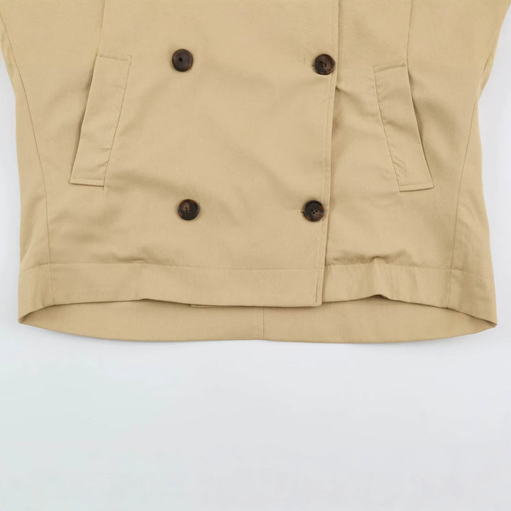 Women's short trench coat in oversized cut with double button placket and shoulder straps Mune Fashion