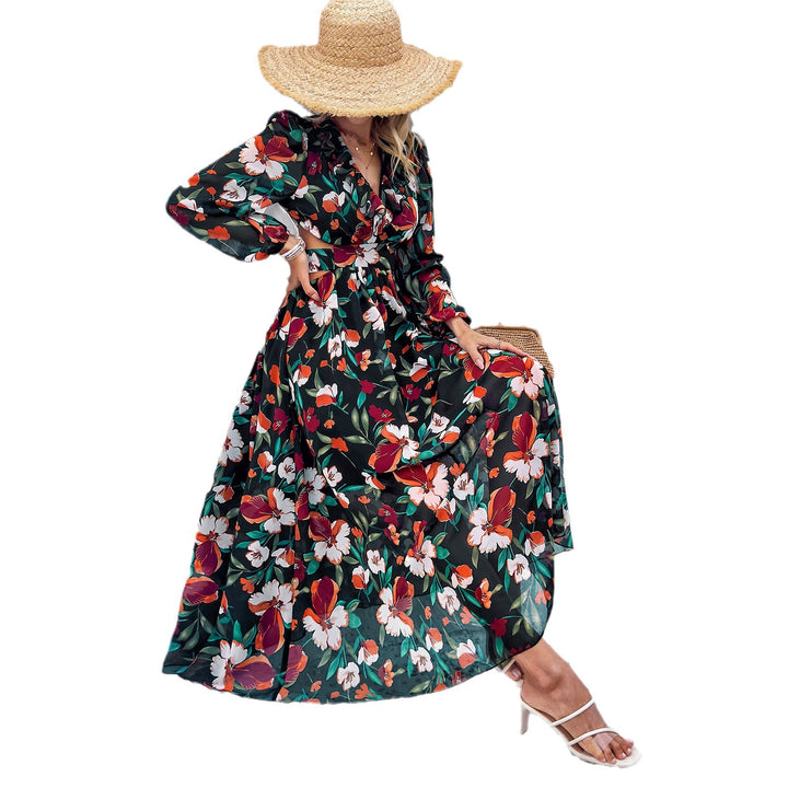 Ladies airy flowing chiffon maxi dress with waist cutouts, ruffled V-neckline and long, sheer sleeves Mune Fashion