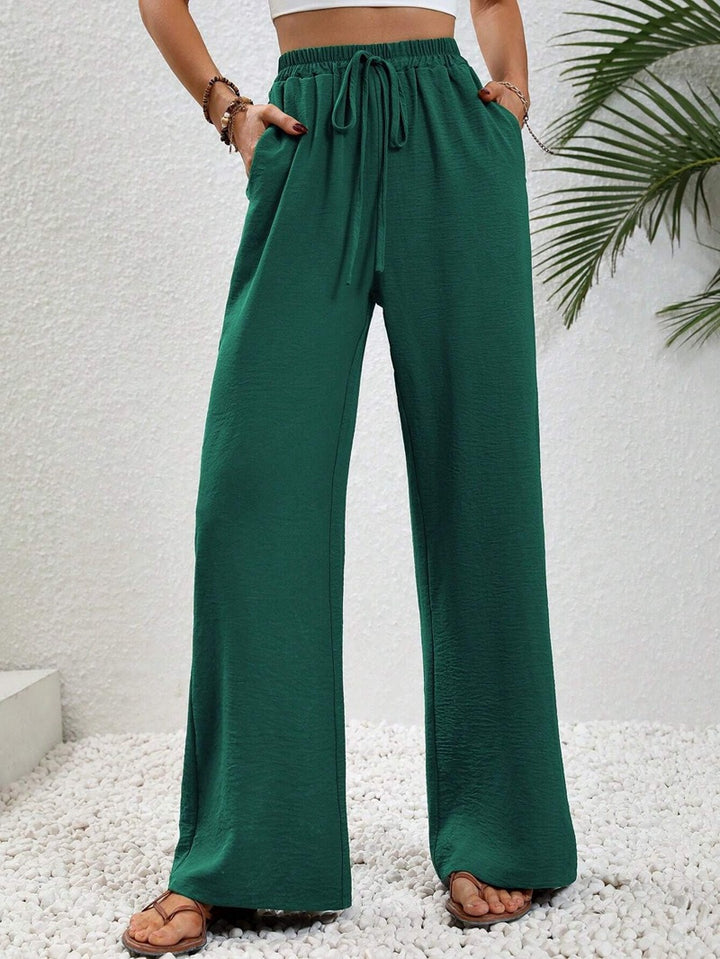 Ladies lightweight, loose-fitting beach pants with elastic waistband, drawstring and side pockets Mune Fashion