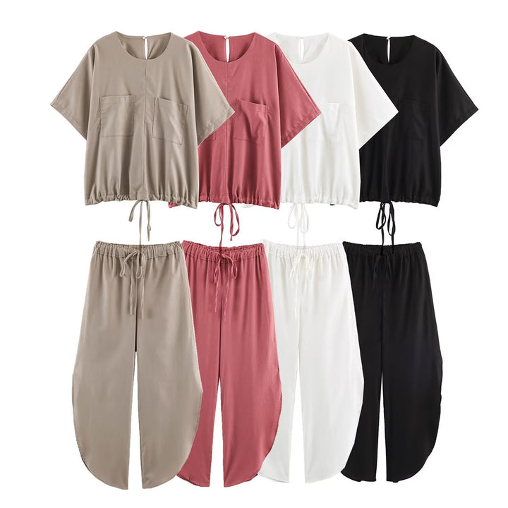 Ladies loose-fitting harem pants with drawstring waistband, mid-slit, and rounded hem Mune Fashion