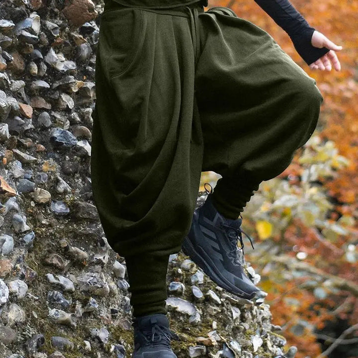 Men's avant-garde harem pants with wrap front, elastic waistband, and slim ankles Mune Fashion
