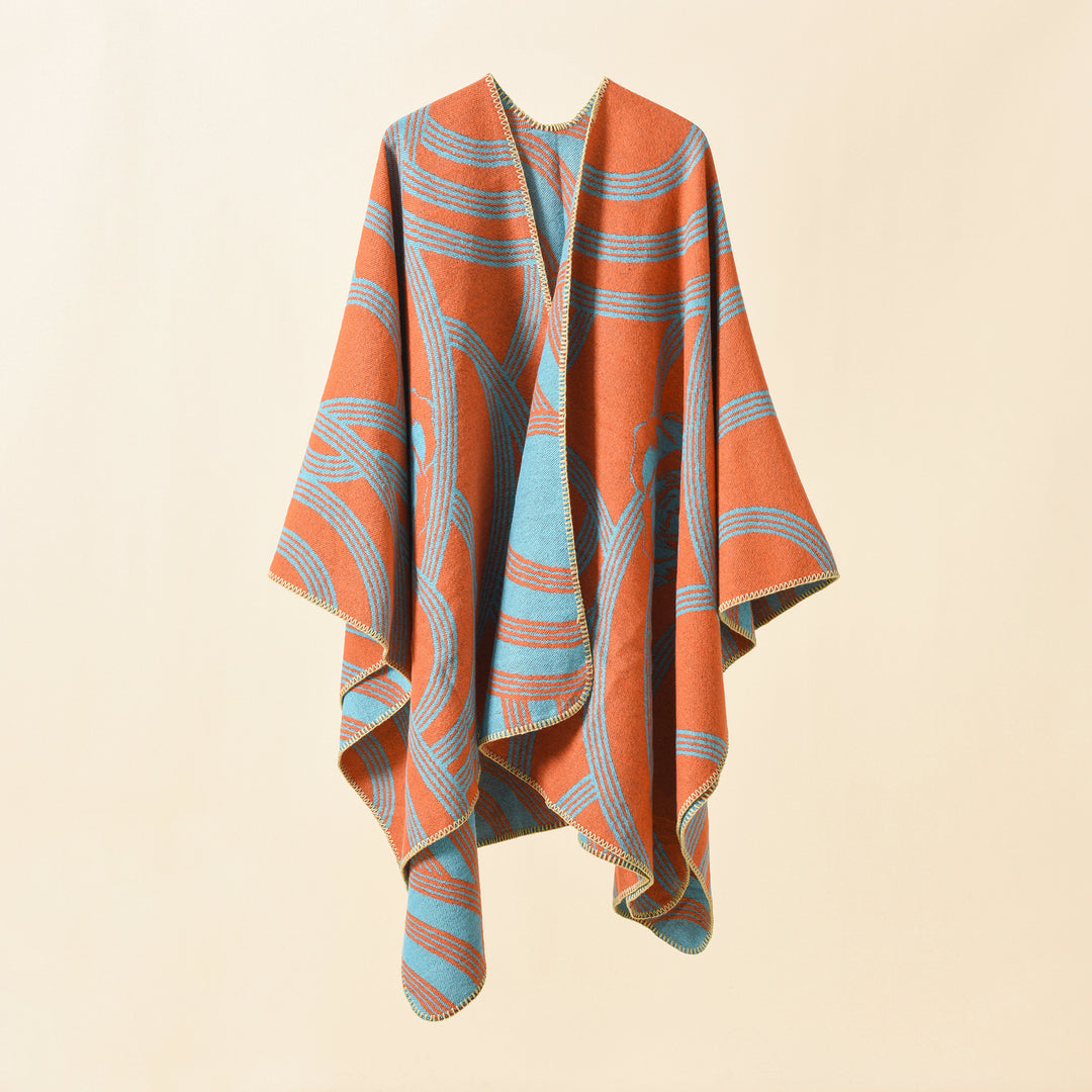 Ladies' collarless jacquard cape in a boxy oversized style with abstract medallion pattern