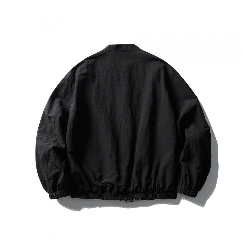 Unisex Light Oversized Bomber Jacket Made of Textured Fabric with Stand-Up Collar and Elastic Hem Mune Fashion