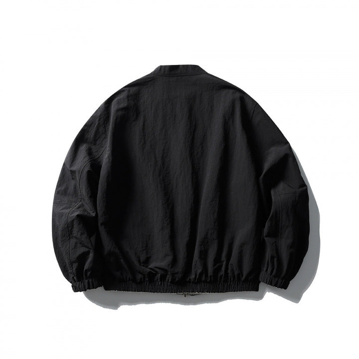 Unisex Light Oversized Bomber Jacket Made of Textured Fabric with Stand-Up Collar and Elastic Hem Mune Fashion