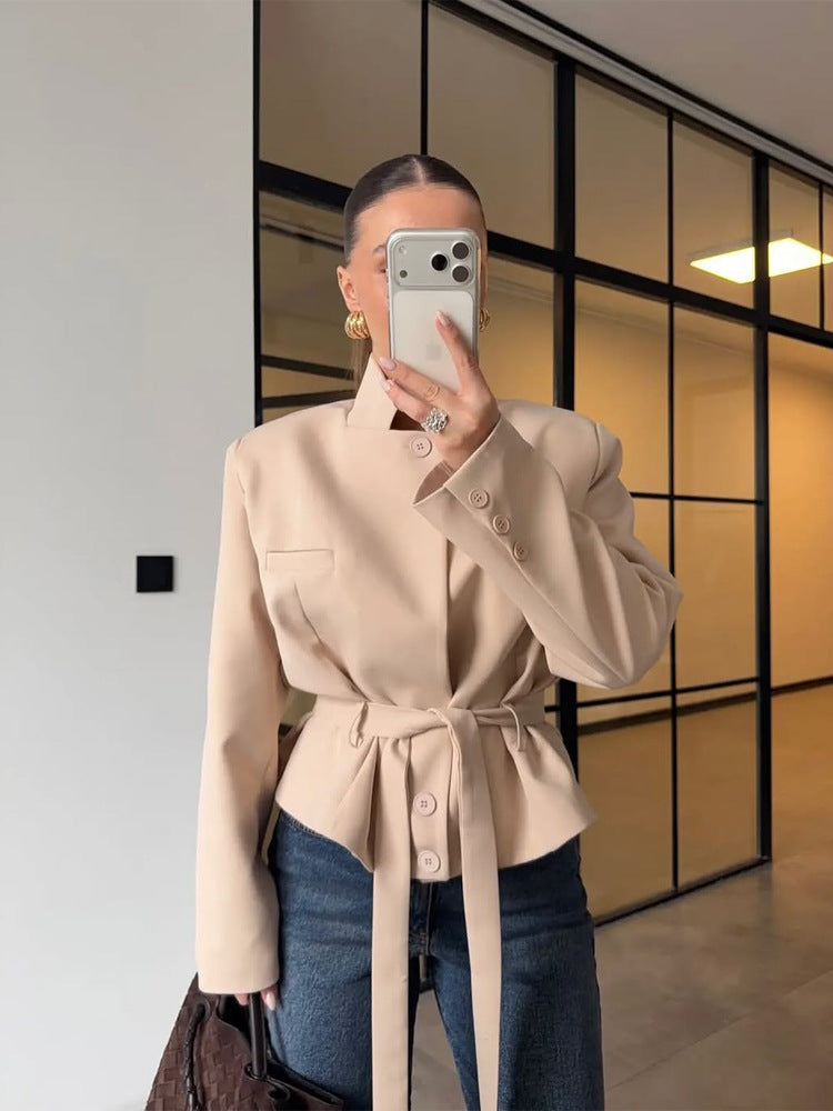 Women's tailored short blazer with standing collar, peplum, and tie belt Mune Fashion