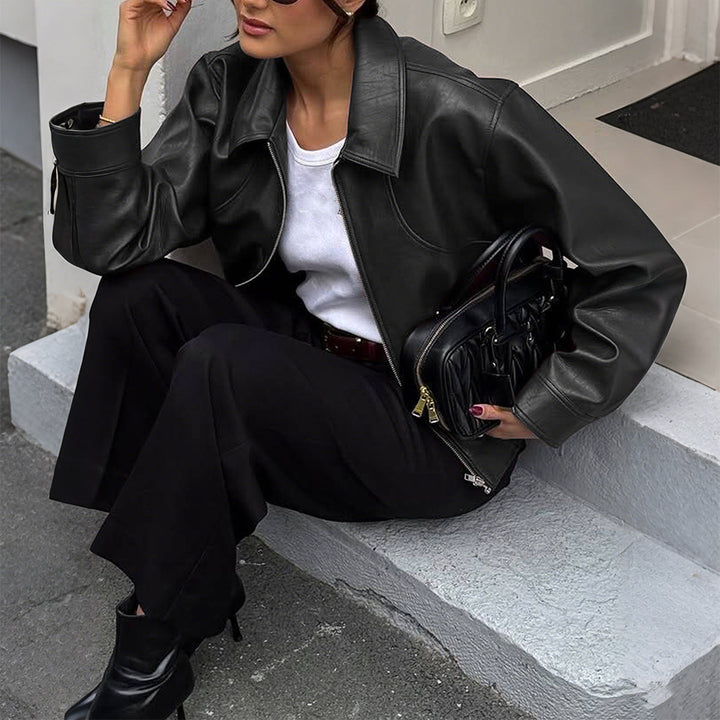 Women's short oversized leather jacket with shirt collar, visible zipper, and casual silhouette Mune Fashion