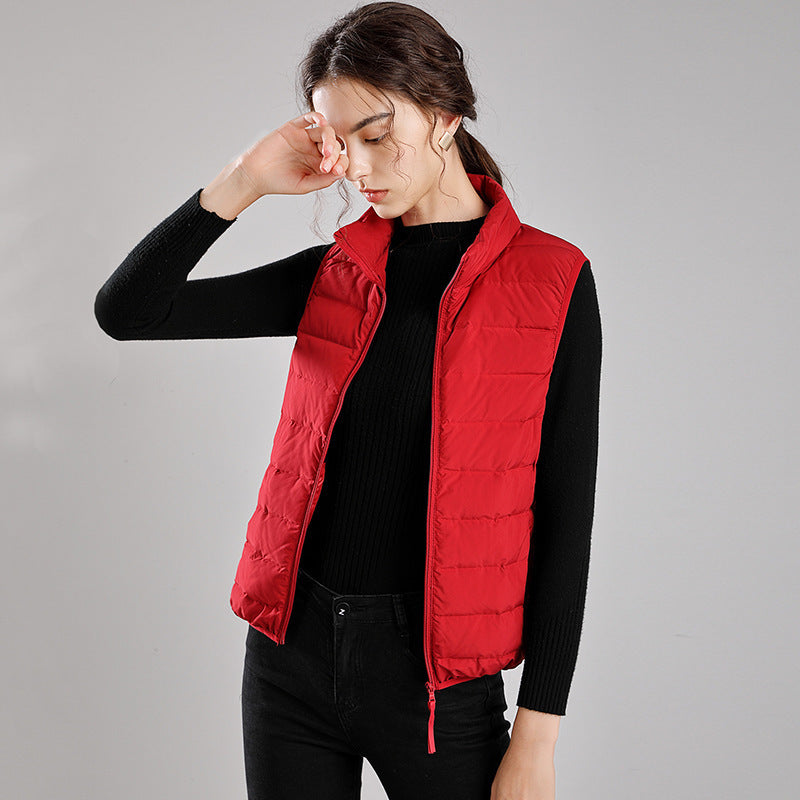 Women's packable quilted vest with flat down look, stand-up collar and side slip pockets Mune Fashion