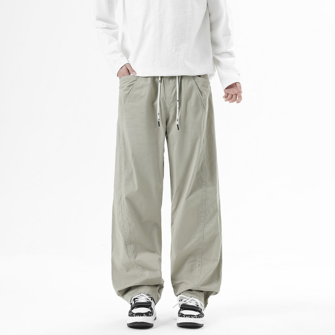 Men's Light Relaxed-Fit Trousers with Drawstring, Slanted Side Pockets and Panel Seams Mune Fashion