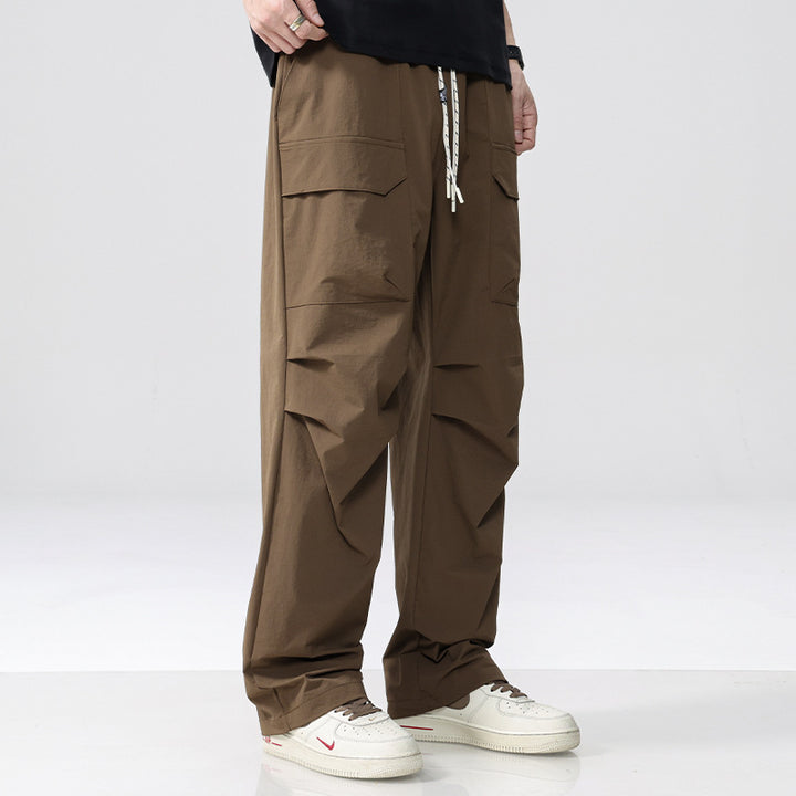 Men's Oversized Cargo Pants made of lightweight functional fabric with drawstring waistband and multiple pockets Mune Fashion