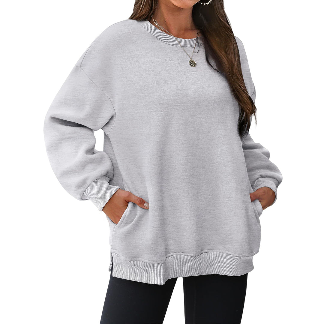Women's extended oversized round neck sweater with side pockets, ribbed cuffs, and dropped shoulder Mune Fashion