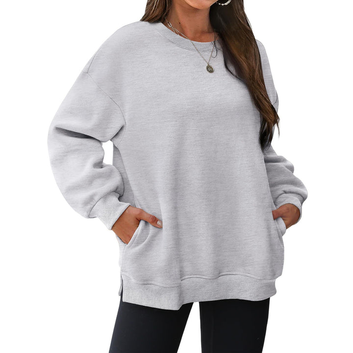 Women's extended oversized round neck sweater with side pockets, ribbed cuffs, and dropped shoulder Mune Fashion