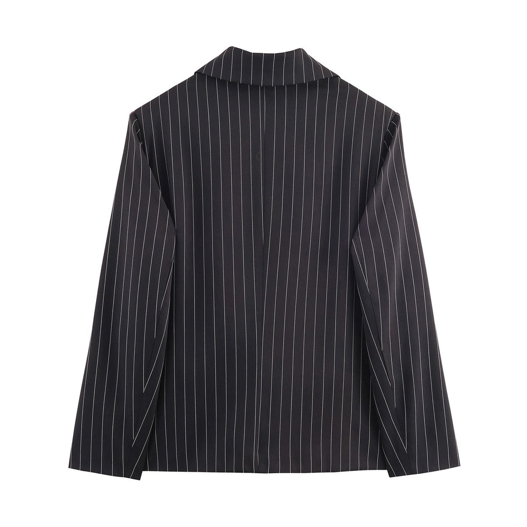 Ladies pinstriped blazer with wide lapels, single-button closure, and flap pockets Mune Fashion