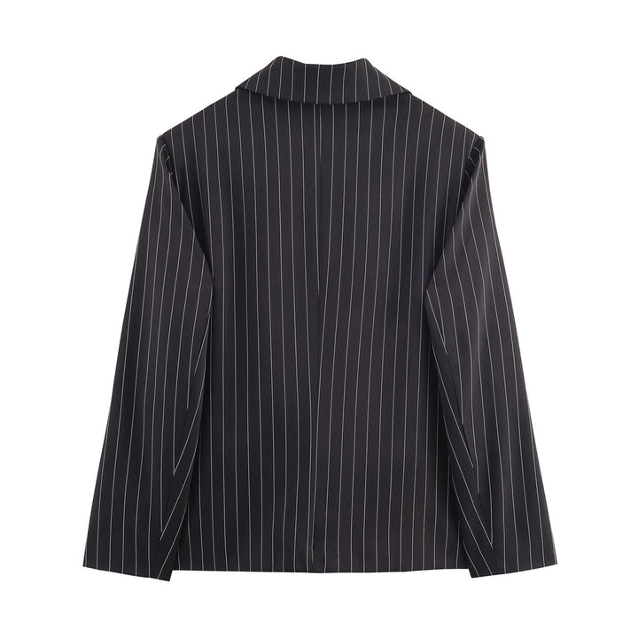 Ladies pinstriped blazer with wide lapels, single-button closure, and flap pockets Mune Fashion