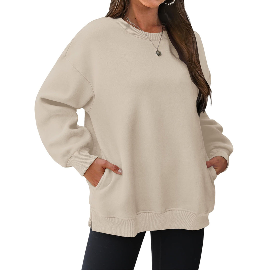 Women's extended oversized round neck sweater with side pockets, ribbed cuffs, and dropped shoulder Mune Fashion