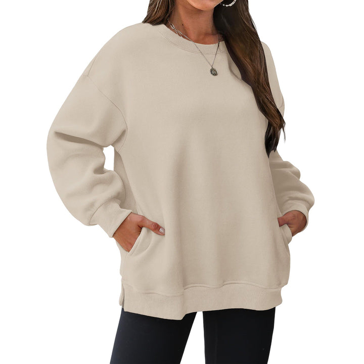 Women's extended oversized round neck sweater with side pockets, ribbed cuffs, and dropped shoulder Mune Fashion