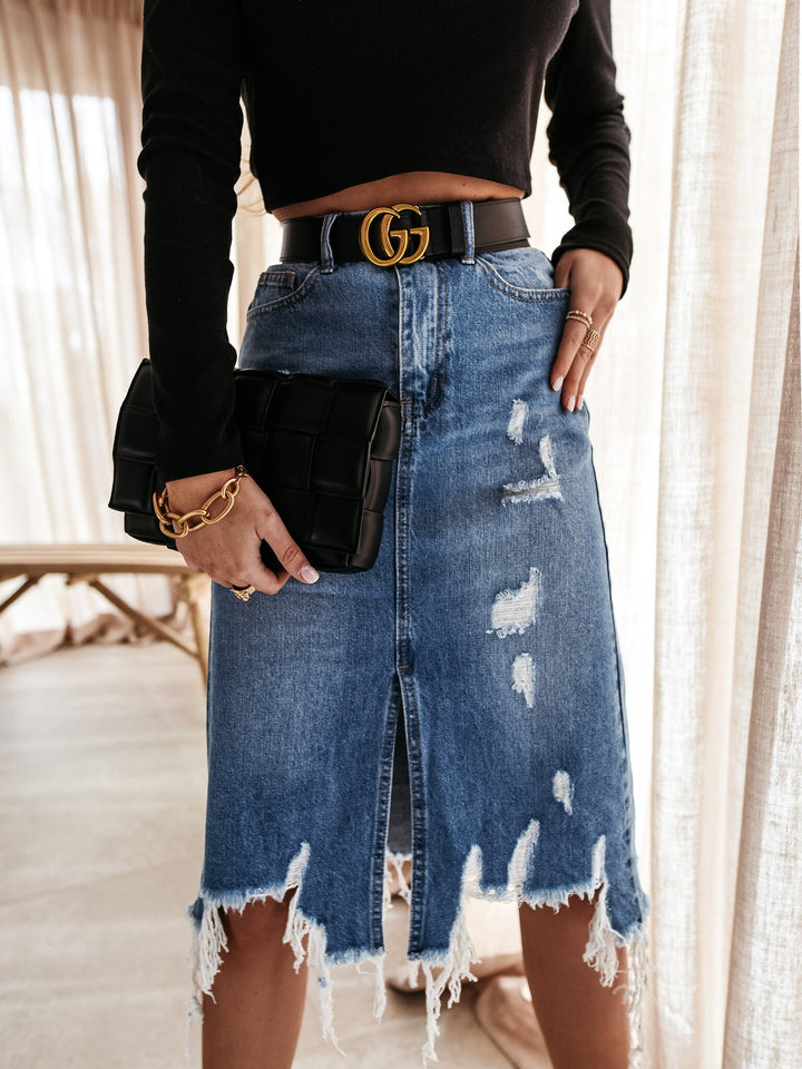 Women's tailored destroyed denim midi skirt with fringing, front slit, and belt loops Mune Fashion
