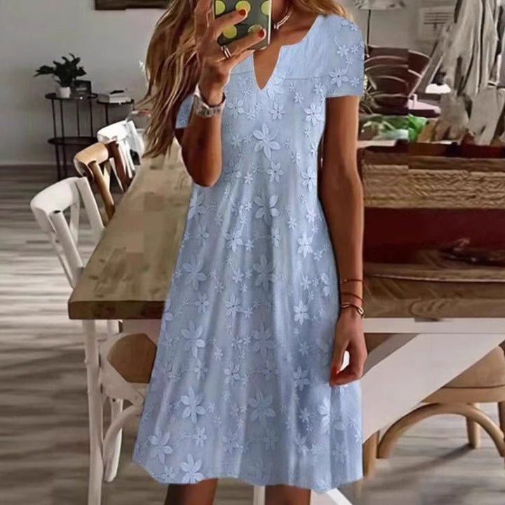 Women's knee-length A-line dress made of cotton blend with embroidered broderie overlay, short sleeves and V-neck Mune Fashion