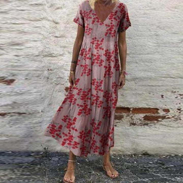 Women’s V-neck maxi dress with fine pleated skirt, empire bodice and short sleeves Mune Fashion