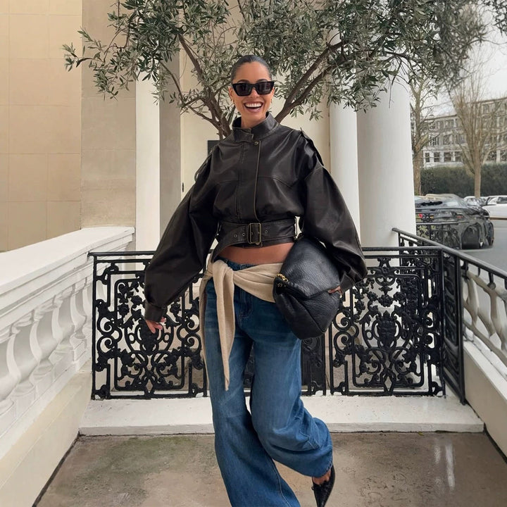 Women Short Cut Faux Leather Biker Jacket with Stand Collar, Waist Belt and Voluminous Sleeves Mune Fashion