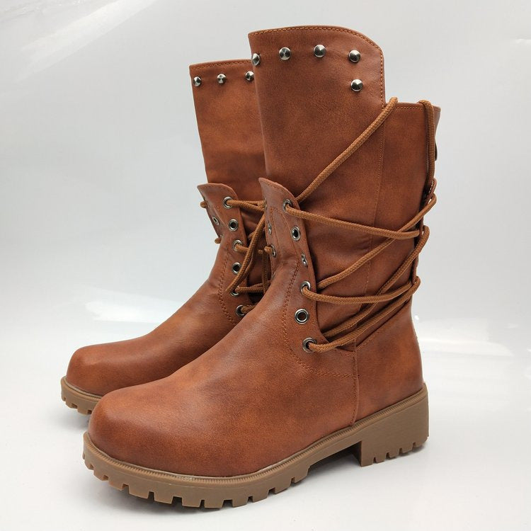 Women's rugged worker boots with decorative wrap lacing, metal eyelets, and profiled rubber outsole Mune Fashion