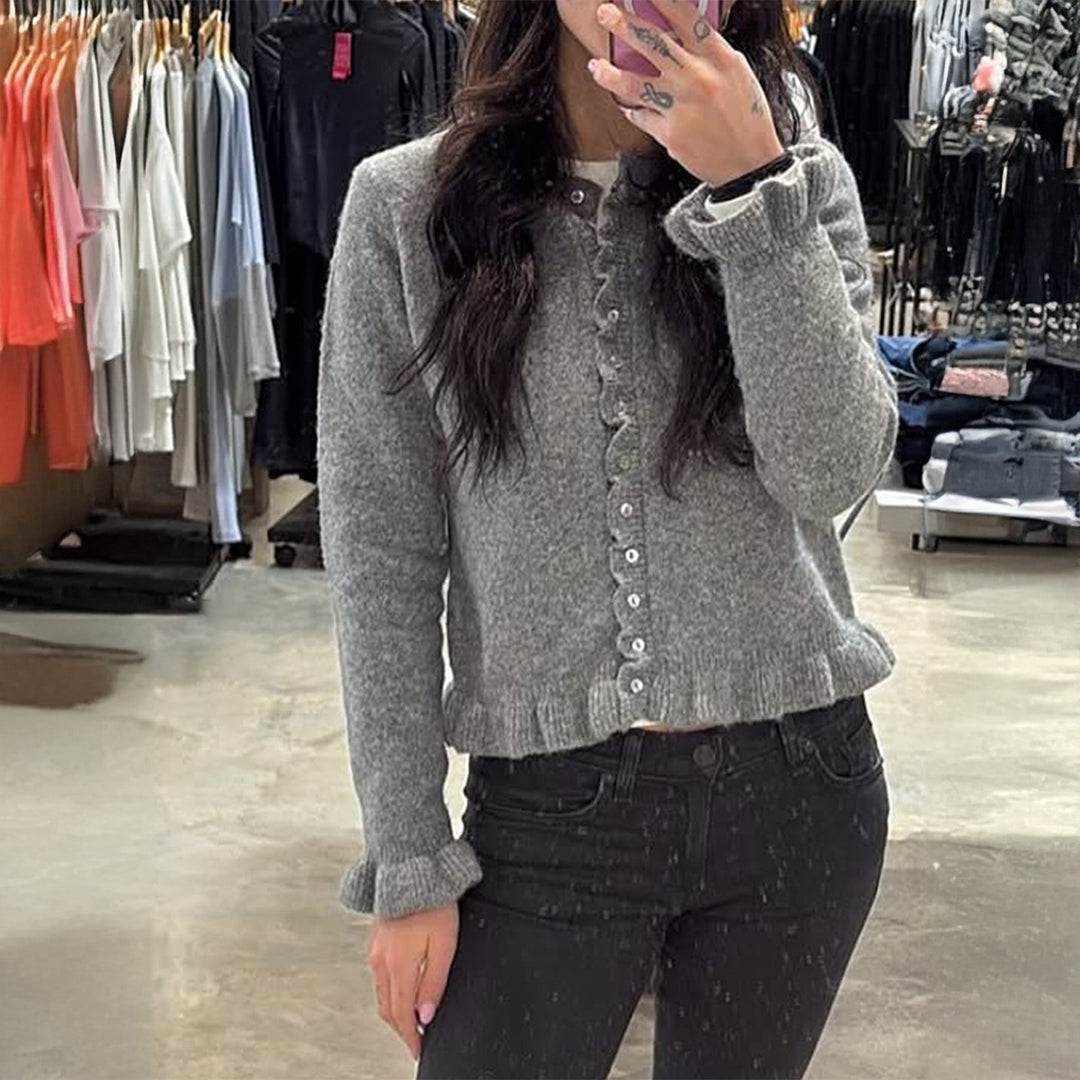 Women’s short cut knit cardigan with ruffled button placket and gathered cuffs Mune Fashion