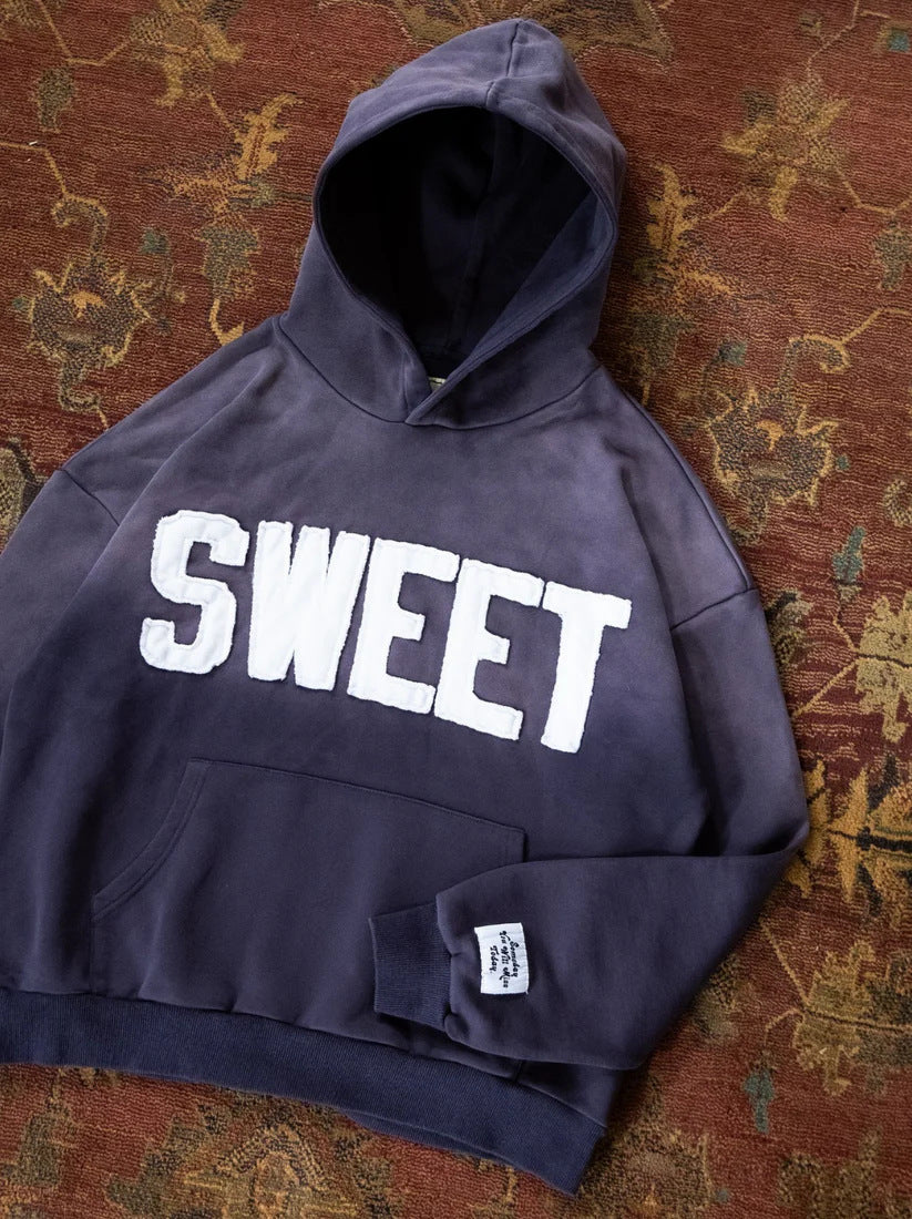 Unisex nan oversized hoodie with appliquéd letter patches and kangaroo pocket Mune Fashion