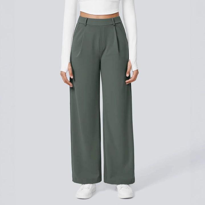 Ladies high-waisted pleated trousers with wide leg, belt loops and side pockets Mune Fashion