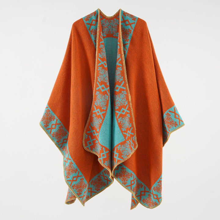 Women's oversized poncho cape made of wool blend with woven border jacquard and decorative chain stitch