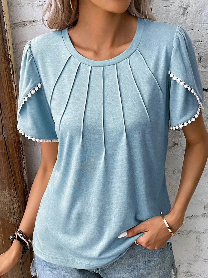 Women's round neck shirt with decorative pleated front, flutter sleeves and pompom trim Mune Fashion