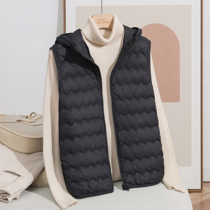 Women Ultra-light Hooded Quilted Vest with Ergonomic Wave Quilting and Compact Packing Format Mune Fashion