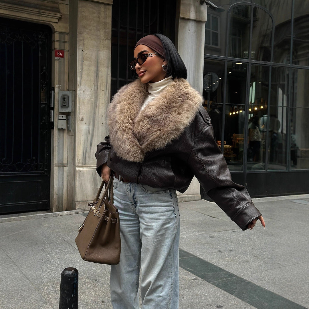 Women's short-cut bomber jacket made of leather look with voluminous faux fur collar Mune Fashion