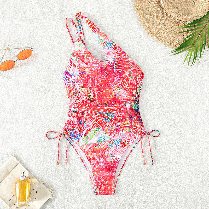 Women's one-piece swimsuit with asymmetrical cut and playful tie band Mune Fashion