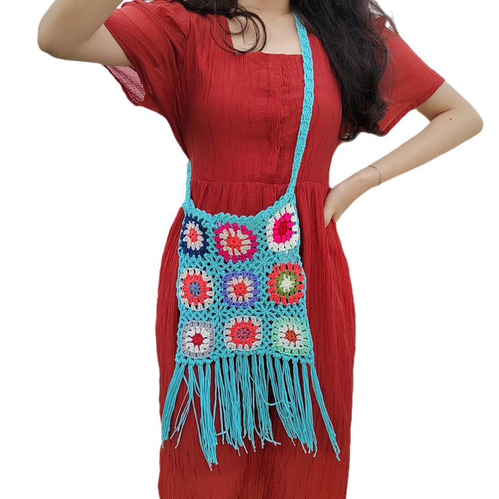 Women crocheted shoulder bag with colorful floral patterns and fringes Mune Fashion