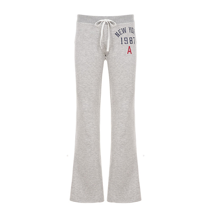 Women's soft flared jogging pants with drawstring, side pockets, and eye-catching Love print Mune Fashion