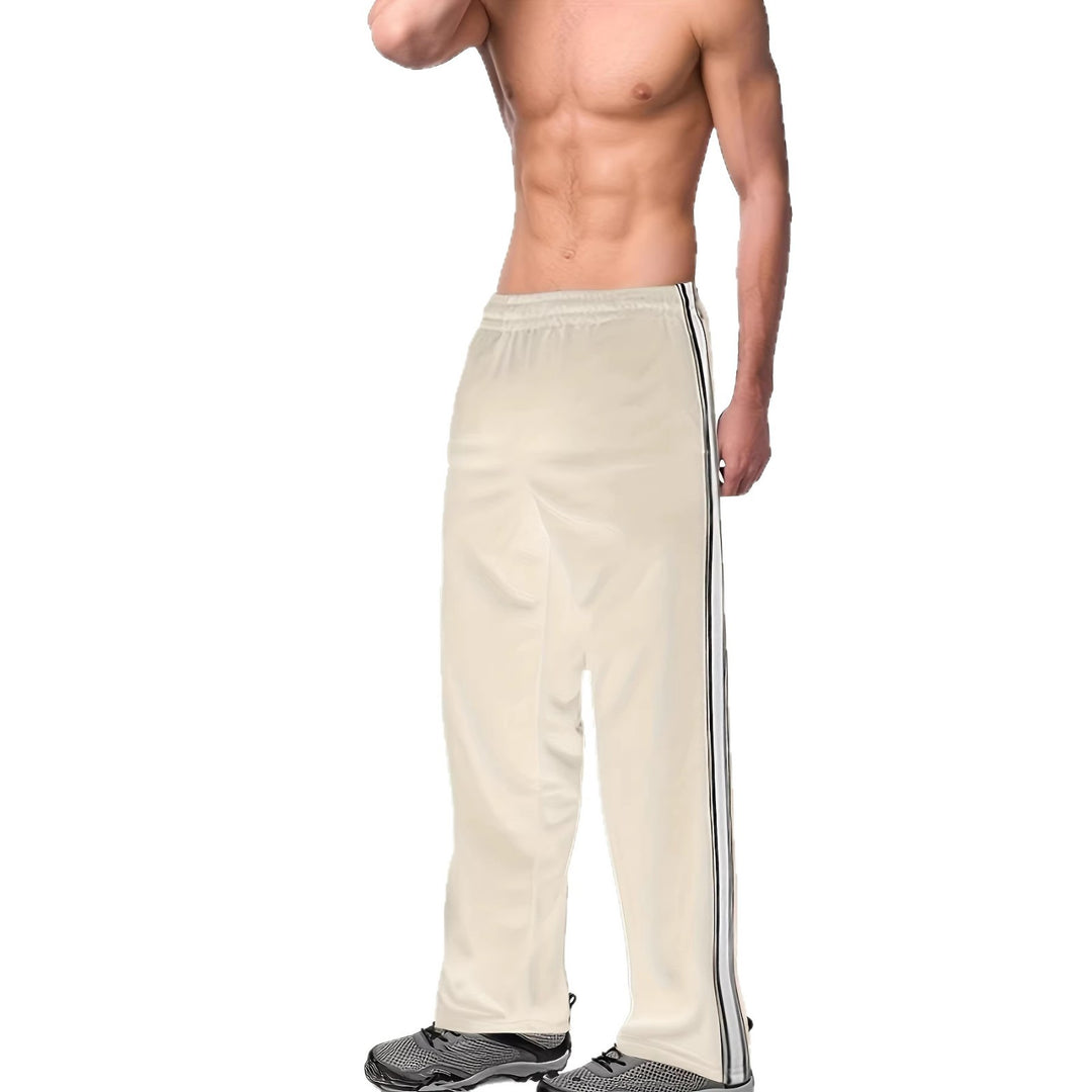Men's sporty training pants with side tape stripes and elastic waistband Mune Fashion