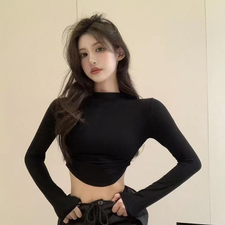 Ladies form-fitting long sleeve cropped top with stand-up collar, side gathering and extended sleeves Mune Fashion