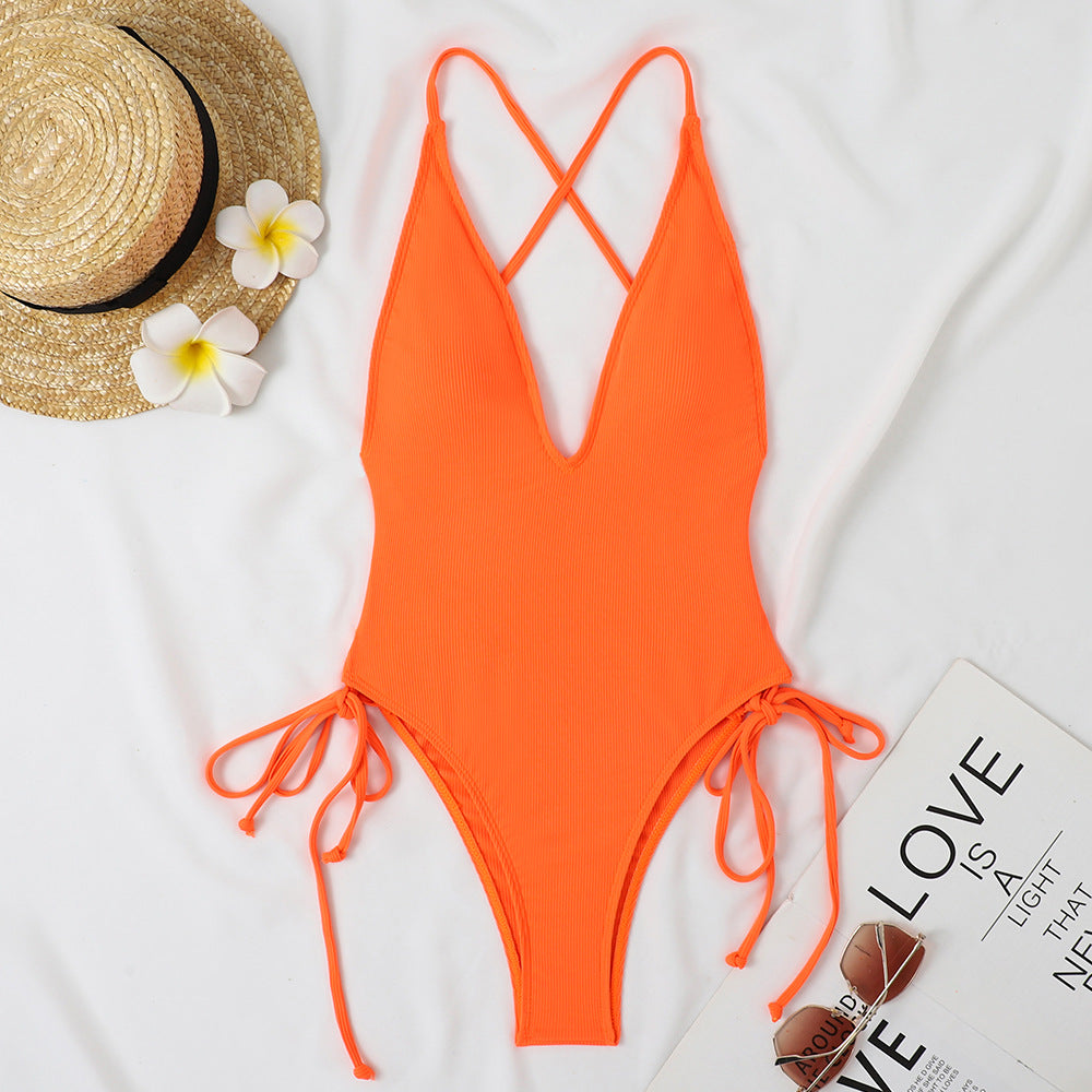 Ladies one-piece swimsuit with deep V-neck and adjustable side ties Mune Fashion